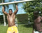 Two young black gay guys kissing and sucking outdoors